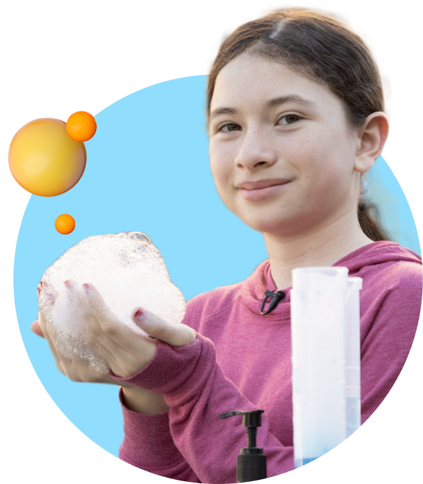 a girl holding a ball of soap